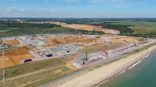 Sizewell C nuclear power plant under construction, aerial drone view, future power energy generation, heavy crane plant machinery England UK