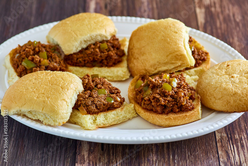 Φωτογραφία platter of sloppy joe style slider sandwiches made with ground beef,  peppers, a