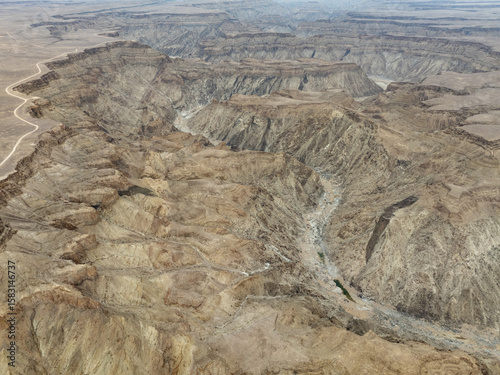 The Fish River Canyon with a length of 160 km is the second largest canyon in the world and the largest in Africa. Aerial view. Drone shot. Ai-Ais Richtersfeld Transfrontier Park, Namibia.