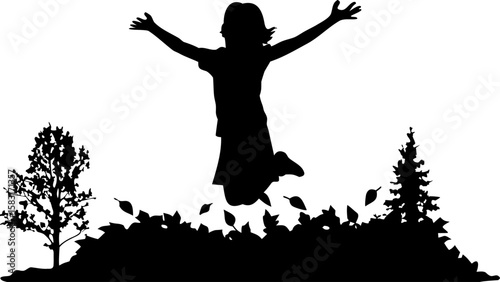 Silhouette of a girl jumping in a pile of leaves with trees on either side in black and white style