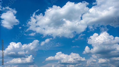Fototapeta Naklejka Na Ścianę i Meble -  Photo of white fluffy clouds float in a clear blue summer sky