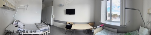 Hospital room. Specialized beds and furniture line the walls. Panoramic shot.