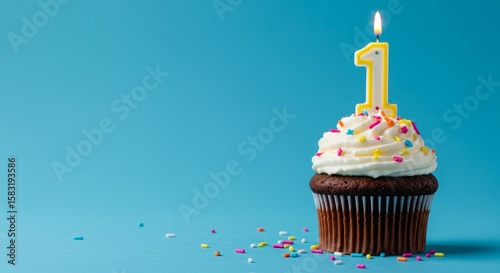 1st birthday. Celebrating First Birthday with a Cupcake and Number One Candle