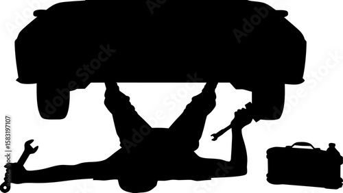 Mechanic silhouette lying under car repairing it with tools and toolbox in a black and white scene