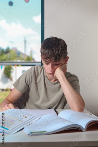 Teenage boy doing home work