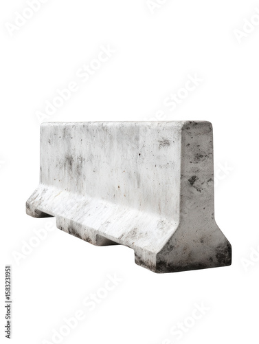 A single concrete jersey barrier with visible wear and tear isolated on a black background
