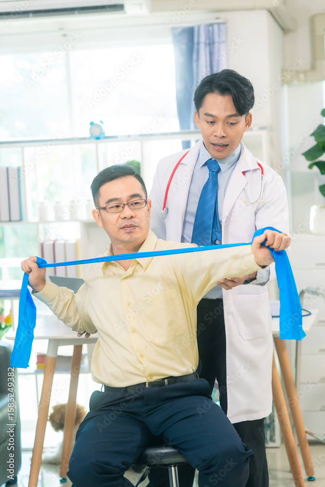 Fototapeta premium Physiotherapist, elderly patients, elastic bands for muscle stretching, bone and joint health care, chiropractors, osteoporosis patients, and post-surgery rehabilitation.