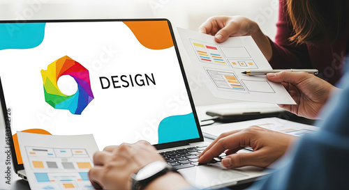 Creative Team Brainstorming Website Design on Laptop. Collaborative Process, UI/UX Development, Digital Marketing Strategy, and Visual Communication