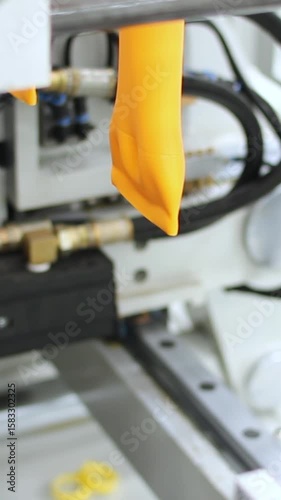 Production of plastic bottles by industrial machinery