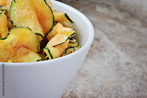 deep fried zucchini chips in white bowl