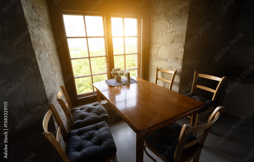 Fototapeta premium Room with stone walls and sunlight through vintage window.