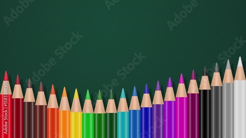 Colored Pencils On Green Copy Space Chalkboard Background Loop