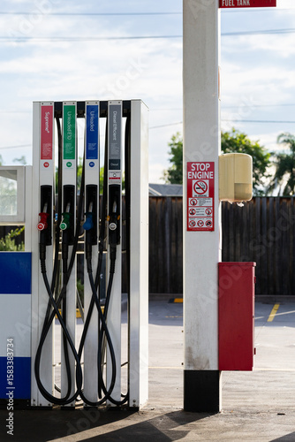 Service station fuel pump with nozzles for selection of petrol and diesel