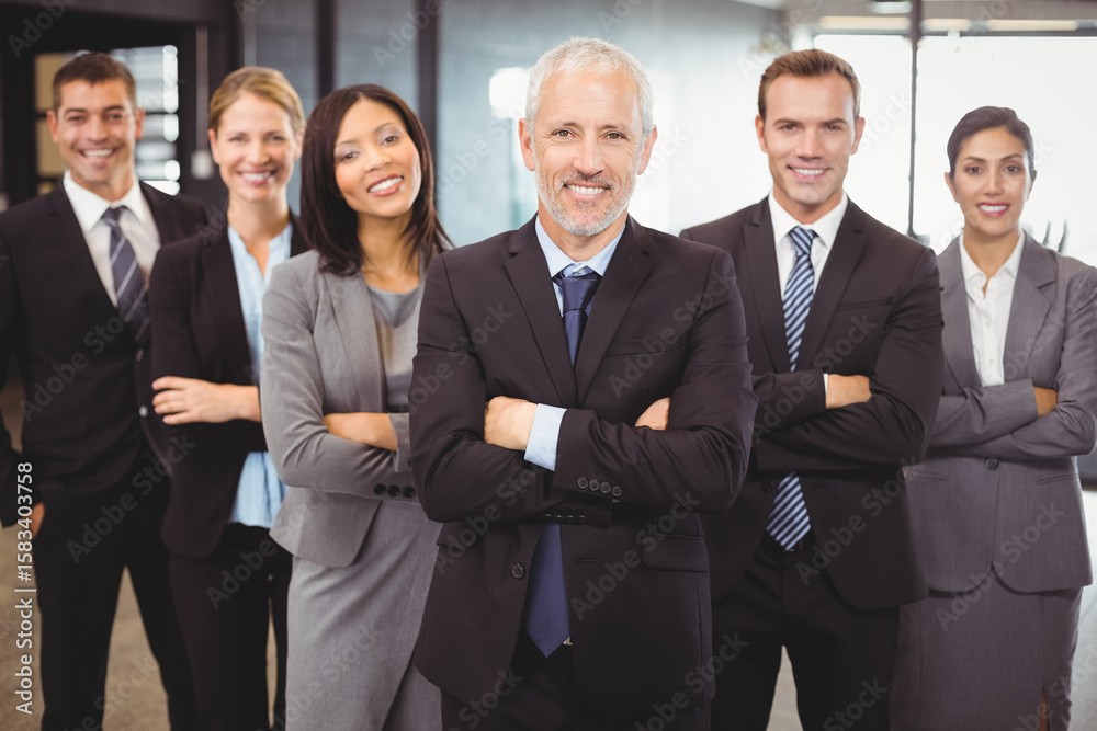 Businesspeople standing with arms crossed Businesspeople standing with arms crossed
