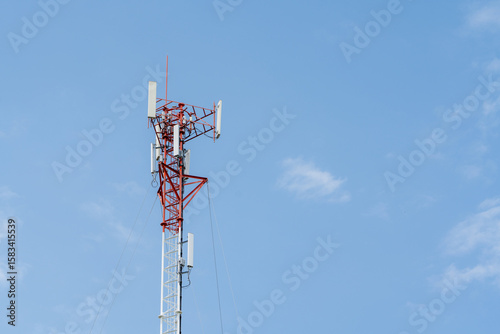 Signal tower or Mobile phone tower with dayligth sky. Telecommunication tower with 5G cellular network antenna. Global connection and internet network concept.
