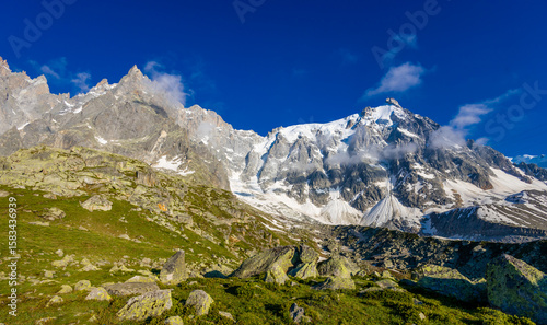 Fotografi Chamonix valley landscape of a prominent rocky towering mountain peak Aiguille du Midi in French Alps