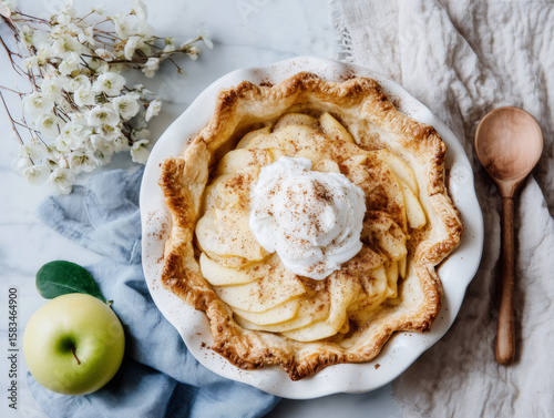 Gourmet apple pie with whipped cream and cinnamon 