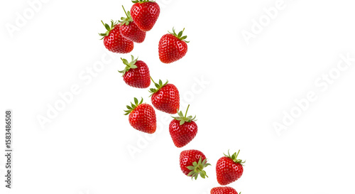Vibrant ripe strawberries cascade freely, showcasing their natural beauty on a bright white backdrop.