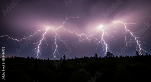 Vivid lightning forks pierce the ominous purple sky during a severe summer thunderstorm.