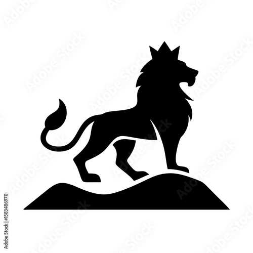 Silhouette of a regal lion sitting on a rock and viewing a vast landscape