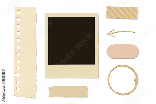 Blank photo frame and decorative paper pieces arranged on a flat surface for creative design projects
