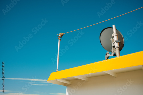 Part of ship roof against blue sky