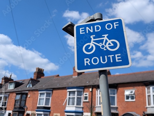 End of Cycle Route sign with terraced houses in the background, England, UK