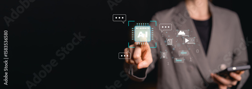 Tableau sur toile Businesswoman using futuristic interface to activate AI agents with digital icon