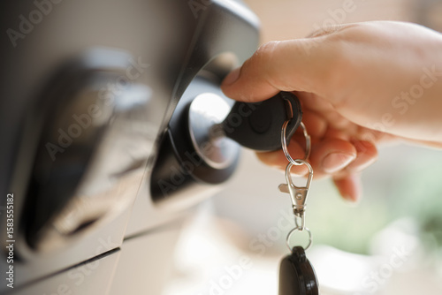 he car owner took the car key to the keyhole to start the car. 
