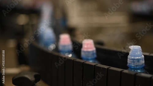 Bottled water on a conveyor belt at a factory. 