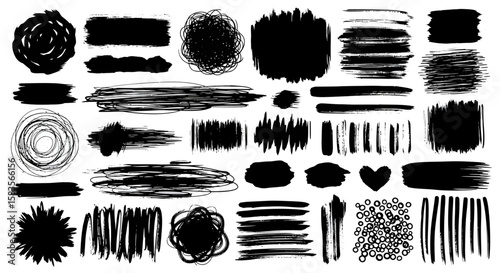 Collection of varied black ink brush strokes splatters and abstract shapes.