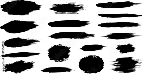 Assorted black ink brushstrokes and splatters creating a textured artistic effect.