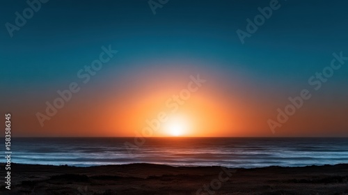 Serene sunset over tranquil ocean waves with a colorful horizon at a peaceful beach