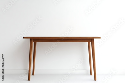 Minimalist wooden desk against a white wall offering a clean and bright workspace design