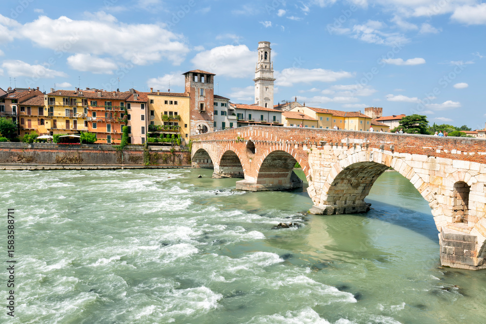 Obraz premium Ponte Pietra bridge is a Roman arch stone bridge crossing the Adige River in Verona, Veneto region in Italy