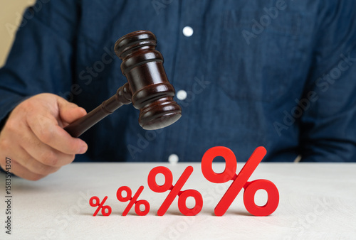 A judge with a gavel and rising interest rates. Regulatory decisions impacting financial markets, central bank policy changes, or government interventions. Inflation control, lending conditions