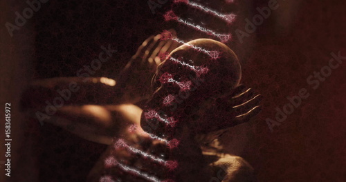 Posing bare-chested man tilting back and cupping temples in studio, projecting double helix pattern