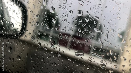 Raindrops on the glass of the window. Stormy, inclement, rainy weather.