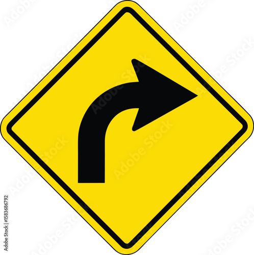 Yellow diamond traffic sign with a black arrow indicating a sharp right turn.