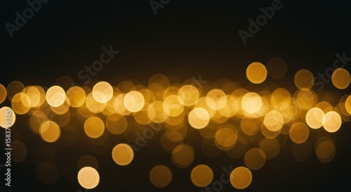 Abstract Golden Bokeh Lights on Dark Background for Festive or Background Use