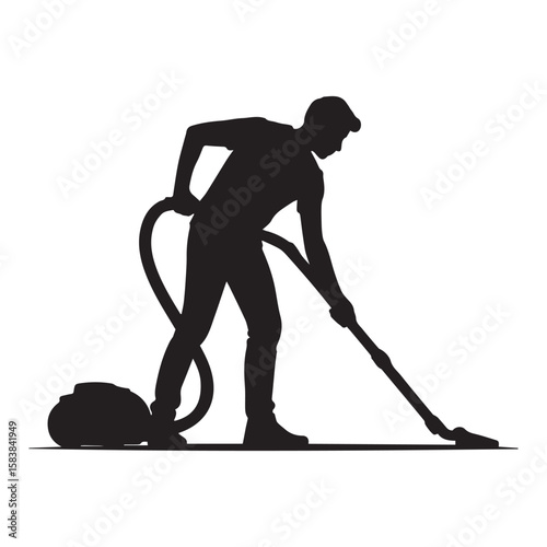 Silhouette of a Man Vacuuming a Floor