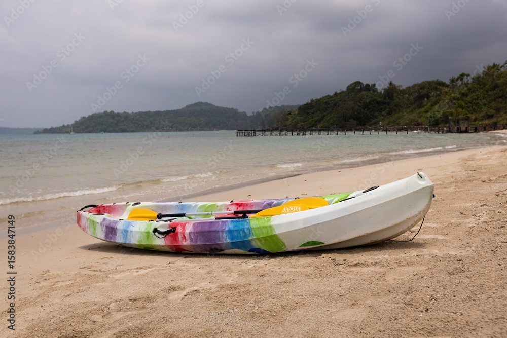 Fototapeta premium Colorful kayak on the sandy beach against the sea in Thailand