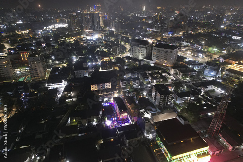 Aerial view of the cityscape ablaze with glittering lights illuminating buildings and streets under the night sky, Lagos, Lagos, Nigeria.
