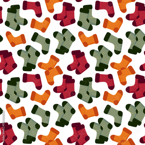 Seamless pattern of colorful knitted socks in autumn tones. Cozy wool texture, flat vector style, scattered layout on white background.