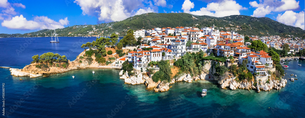 Obraz premium Greece travel destination scenic places - Skiathos island, Sporades. Popular tourist attraction - tradiotional old town , aerial drone panoramic view