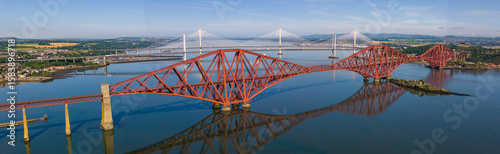Photography Panoramic aerial image featuring the Forth bridge with the Forth Road Bridge and Queensferry crossing Bridge on the background