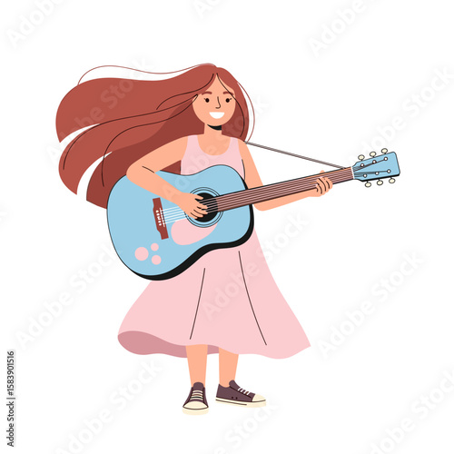 Young girl playing guitar and enjoying music on International Music Day  