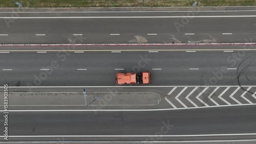 A cleaning machine moves along the highway