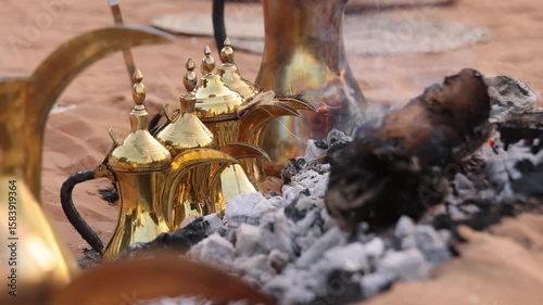 Traditional coffee pots on a fire, hospitality beverage in Arabic culture, UAE heritage concept