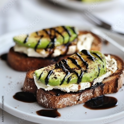Rye toast: avocado, ricotta, balsamic. Breakfast focus.